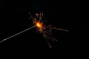 closeup view of burning sparkler photo