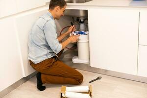 Installation of reverse osmosis water purification system. photo