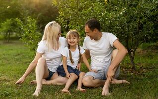 Happy family enjoying in park on sunny a day photo