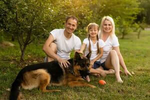 Happy family enjoying in park on sunny a day photo