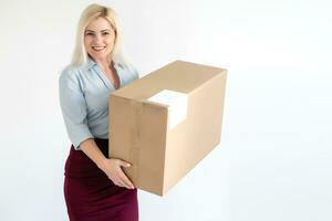 A young beautiful caucasian woman holding a box in her hands. photo