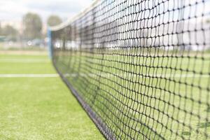 Tennis net and court. Playing Tennis. Healthy lifestyle photo