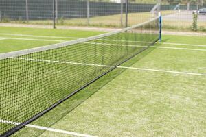Tennis net and court. Playing Tennis. Healthy lifestyle photo