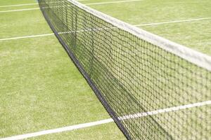 Tennis net and court. Playing Tennis. Healthy lifestyle photo