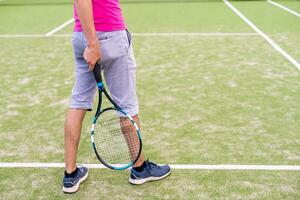 Male tennis player on the tennis court photo