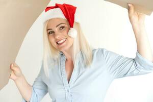 Pleasant woman opening cardboard box photo