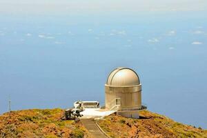 telescope on top of a mountain photo