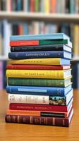 AI generated A stack of books with colorful spines, representing a variety of subjects and academic disciplines photo