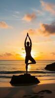 AI generated A man doing yoga on a beach, with the ocean and sunrise in the background photo