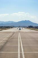 AI generated panoramic view of an airport runway with planes parked and in motion photo