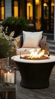 AI generated beautifully designed outdoor patio area with modern furniture, potted plants, and a cozy fire pit. photo