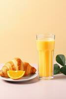 AI generated A glass of orange juice accompanied by a croissant with butter and jam photo