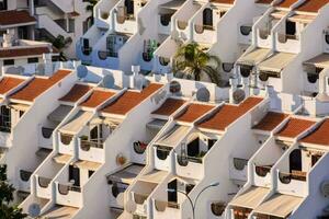 a row of white and red buildings photo