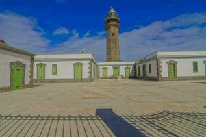 the old lighthouse next to a courtyard photo