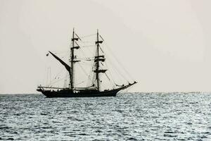 a tall ship in the ocean photo