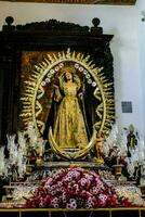 a statue of the virgin mary in a church photo