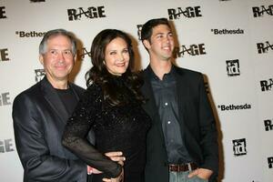 LOS ANGELES  SEPT 30  Lynda Carter husband son arriving at  the RAGE Game Launch at the Chinatowns Historical Central Plaza on September 30 2011 in Los Angeles CA photo