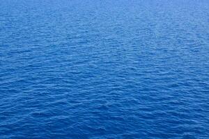 the ocean is blue and calm photo