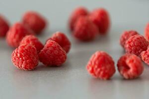 red Raspberry fruit on gray background photo