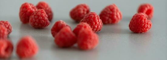 red Raspberry fruit on gray background photo