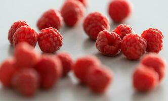 red Raspberry fruit on gray background photo