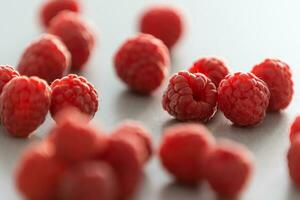 red Raspberry fruit on gray background photo