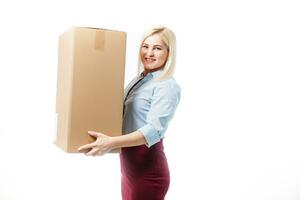 A young beautiful caucasian woman holding a box in her hands. photo