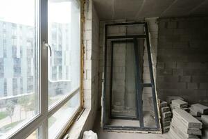 Abandoned house interior, dirty room, rotten peeled walls. photo