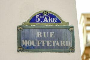 a street sign that reads rue mouffetard photo