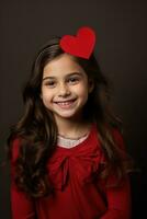 ai generado retrato de un linda pequeño niña con rojo corazón en san valentin día concepto. foto