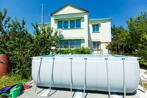 frame pool in the garden of a private house, summer photo