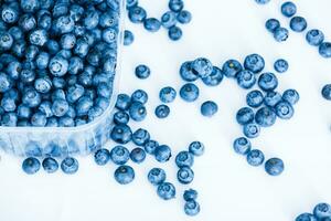 Falling blueberry, isolated on white background, clipping path, full depth of field photo