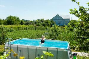 Private swimming pool at summertime photo