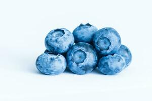 Group of fresh juisy blueberries isolated on white background photo