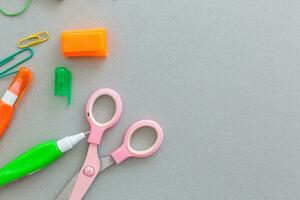 Material for school, paper clips, pencils, colors, scisor and notebook photo