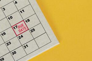 Red mark on the calendar at 17 for reminder of due date. photo