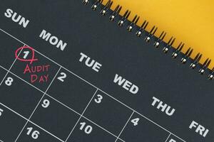 Red circle mark on the calendar at 1 for reminder of Audit Day. photo