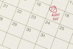 Red circle mark on the calendar at 17 for reminder of Audit Day. photo