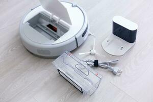 Robotic vacuum cleaner. Container with garbage from a smart robot vacuum cleaner. housework and technology concept photo