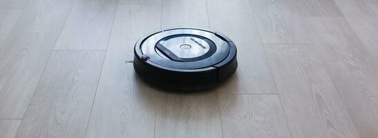 closeup robotic vacuum cleaner over white background photo