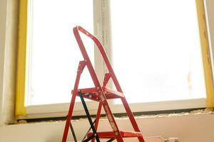 Repair in the slopes of the window. The process of applying a layer of plaster on the sides of the window. photo