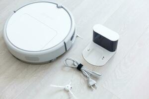 Robotic vacuum cleaner. Container with garbage from a smart robot vacuum cleaner. housework and technology concept photo
