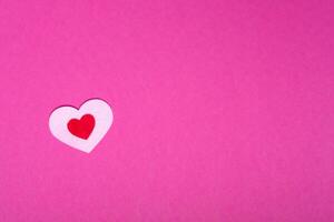 heart on a pink background for a greeting card or banner for Valentine's Day, copy space photo