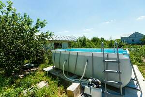 Private swimming pool at summertime photo