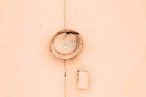 metal Peach Fuzz doors with a lock abstract background. Monocolor texture pattern with copy space photo