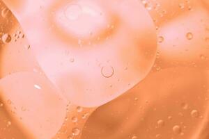 Pink Oil bubbles close up. circles water macro. abstract shiny viva magenta background photo