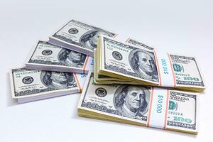 Set of a packs of dollars with a rubber band isolated on a white background photo