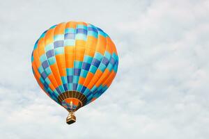 hot air balloon over blue sky. Composition of nature and blue sky background photo