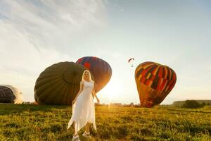 A tourist woman enjoying wonderful view of the balloons. Happy Travel concept photo