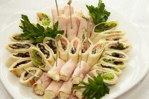 Buffet Snack Food.Snack food for a buffet table. Rolls with filling photo